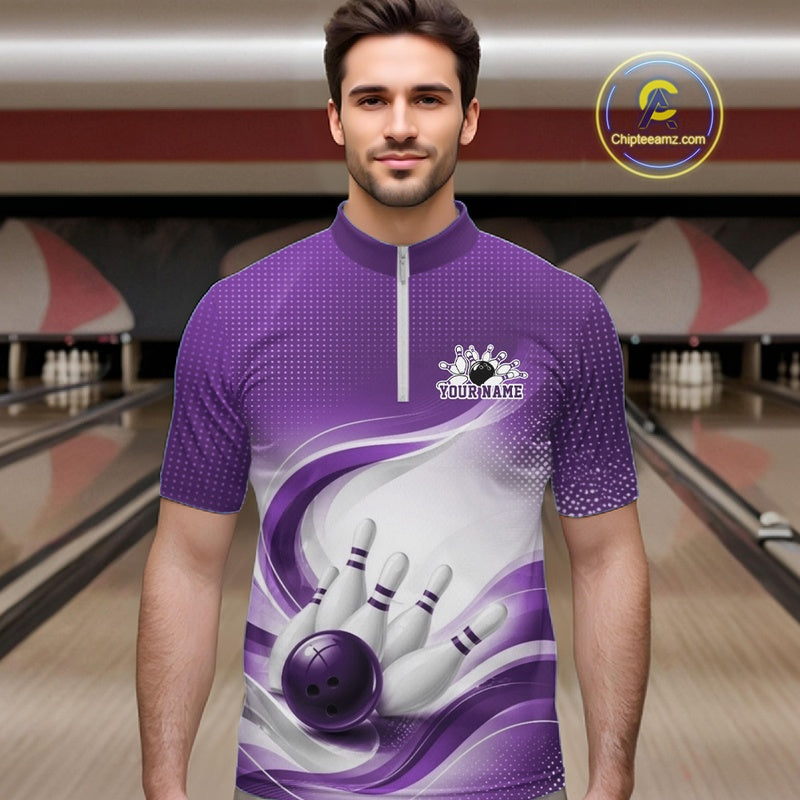Male model wearing a white and purple bowling quarter-zip shirt featuring flowing abstract artwork and a bowling ball knocking down pins
