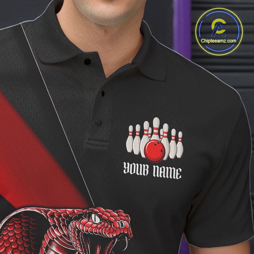 Close-up left chest graphic on a black bowling polo featuring a red cobra and bowling ball motif.