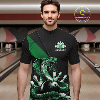 Male model wearing a black quarter-zip at the bowling lane with green cobra artwork and bowling-themed accents.