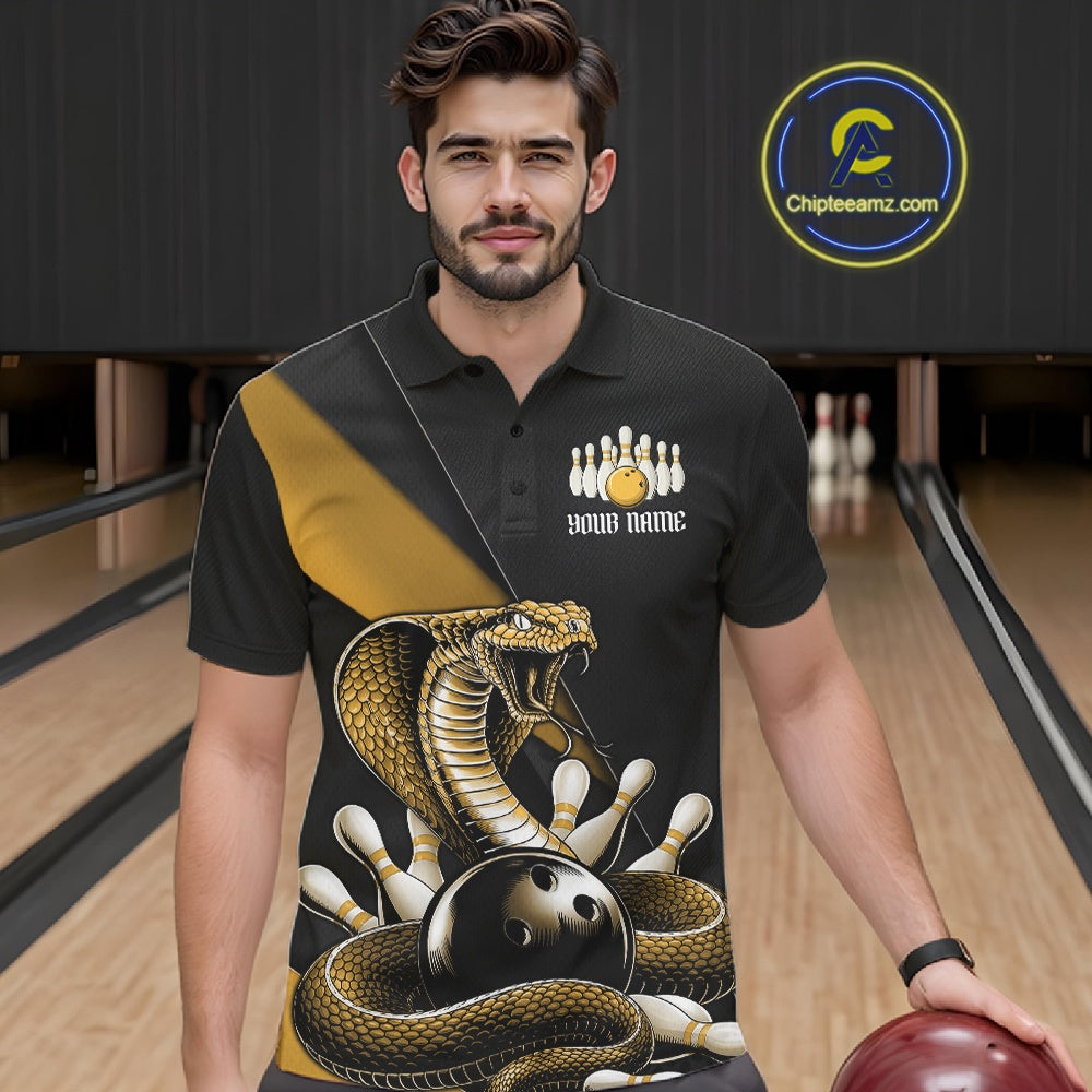 Male model wearing a black bowling polo at the bowling lane with yellow cobra artwork and scattered pin graphics.