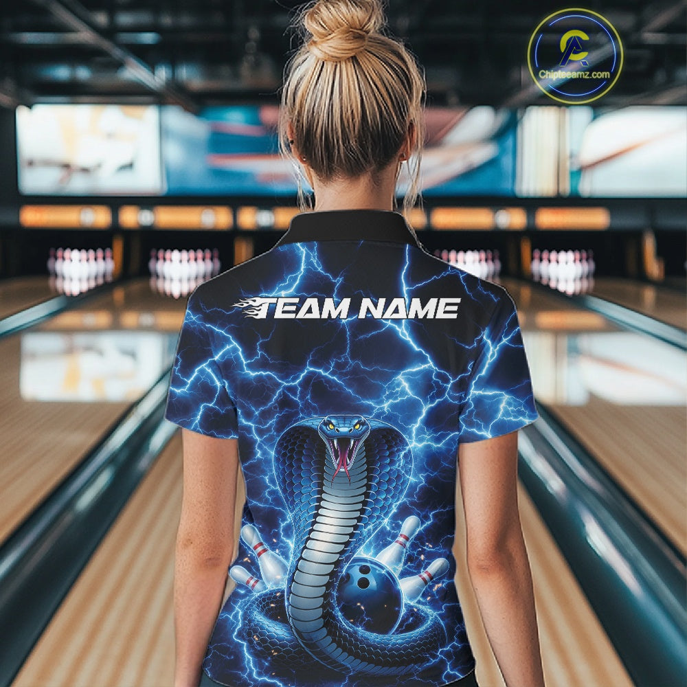 Back view of a womens bowling quarter-zip showcasing a blue cobra and bowling ball motif with lightning effects.