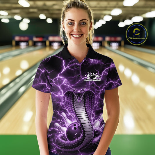 Female model wearing a bowling polo in a bowling lane with a purple cobra coiled around a bowling ball and lightning background.