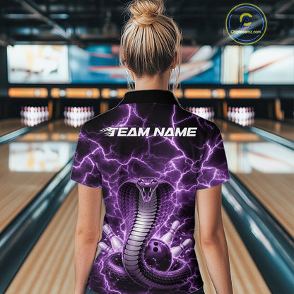 Back view of a womens bowling polo displaying a purple cobra wrapped around a bowling ball with lightning accents.