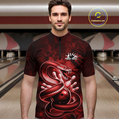 Male model at the bowling lane wearing a quarter-zip decorated with red cobra artwork and bowling-themed graphics.