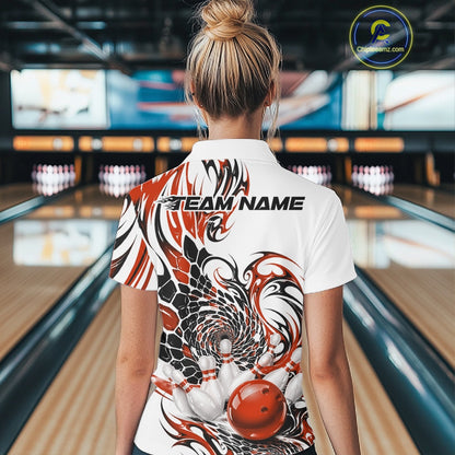 Back view of a female model wearing a white bowling quarter-zip shirt with orange and black tribal artwork, scale-like patterns, and a red bowling action illustration
