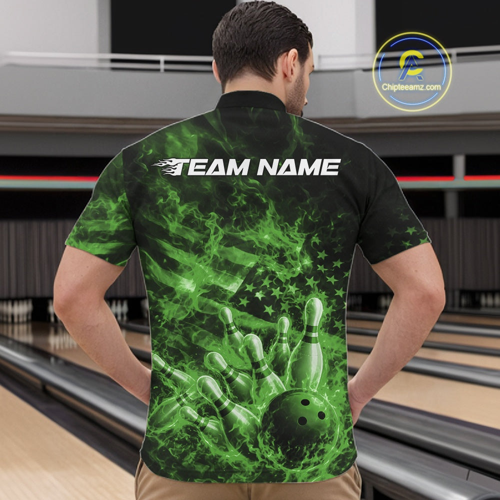 Front view of a mens black and green quarter-zip showcasing a bowling ball smashing through pins with flames and flag-inspired graphics.