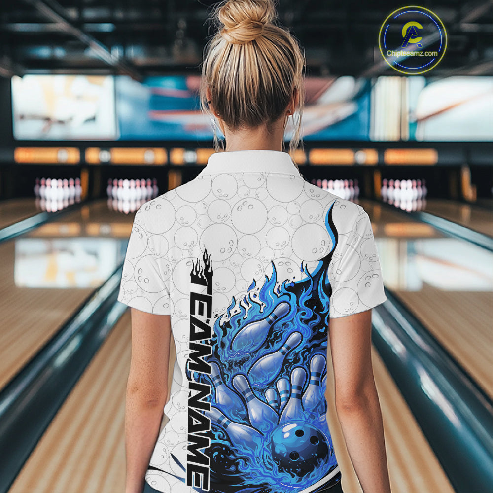 Back view female model in bowling lane wearing white and blue quarter zip featuring flaming bowling ball crashing into pins with dynamic fiery bowling graphics.