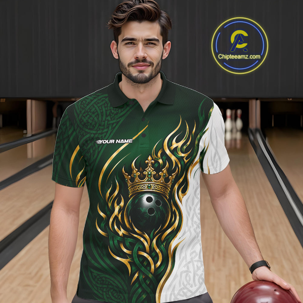 A man wearing a custom bowling-themed short-sleeve polo shirt with a green, white, and gold flame-and-crown graphic, standing in a bowling alley holding a bowling ball. 