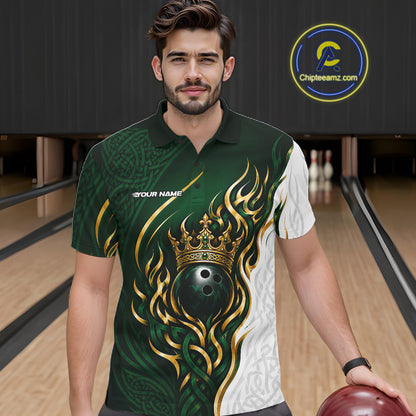 A man wearing a custom bowling-themed short-sleeve polo shirt with a green, white, and gold flame-and-crown graphic, standing in a bowling alley holding a bowling ball. 