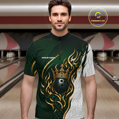 A man wearing a short-sleeve bowling-themed quarter-zip shirt with a dark green and white design featuring a gold crown and bowling ball graphic, set against a bowling alley background.