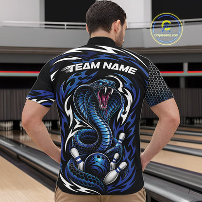 A man viewed from behind wearing a black short-sleeve bowling quarter zip shirt with a large blue and white cobra graphic and the words 'TEAM NAME' across the upper back.