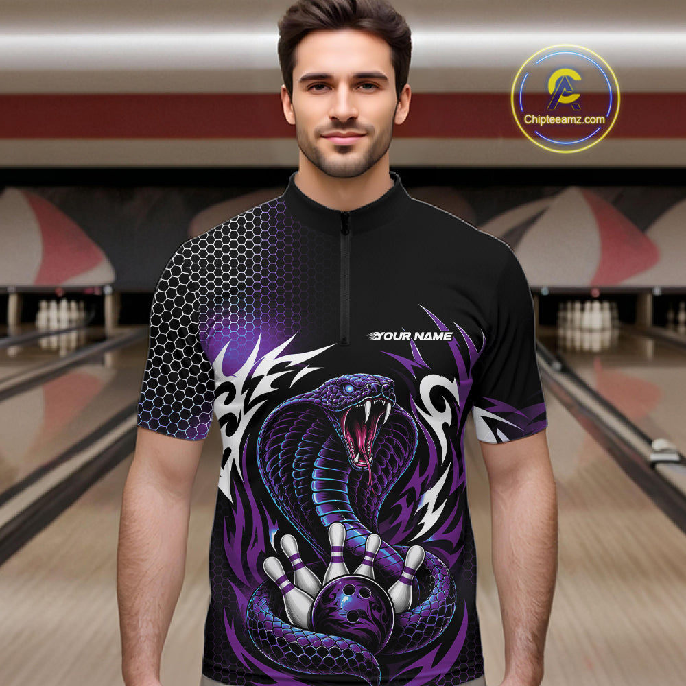 A man wearing a black short-sleeve quarter zip shirt bowling jersey with a purple and black cobra snake graphic, standing in a bowling alley. The jersey features a black honeycomb pattern on the right sleeve, a purple and black cobra design on the front, and a white 'YOUR NAME' placeholder print on the chest.