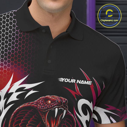 A close-up of a black short-sleeve polo shirt worn by a model, featuring a red and black snake graphic, white tribal-style patterns, and a customizable name print on the chest. 