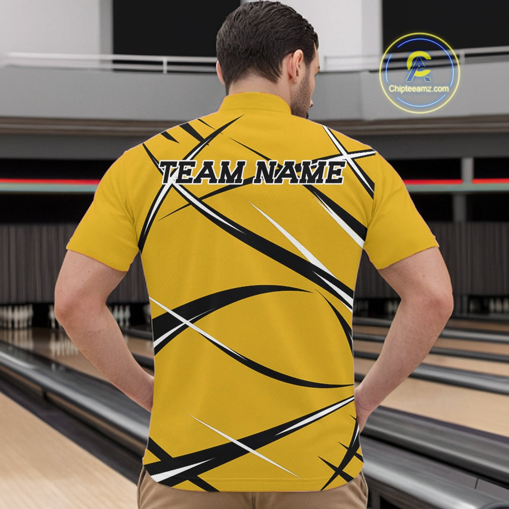 Front view of a male bowler in a bowling alley wearing a yellow, black, and white bowling quarter zip shirt