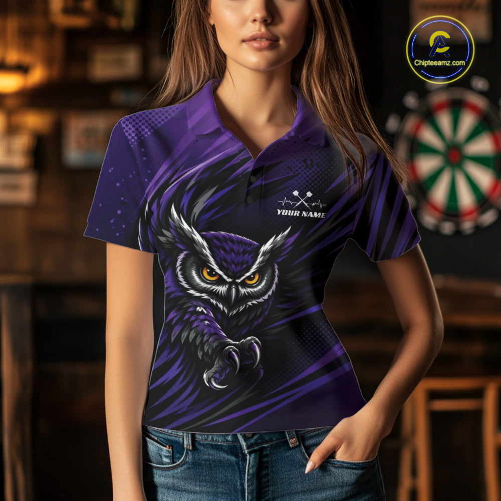 Front view of a woman wearing a purple and black darts polo shirt, pairing a striking owl graphic with personalized names, a flying dart, and dartboard.