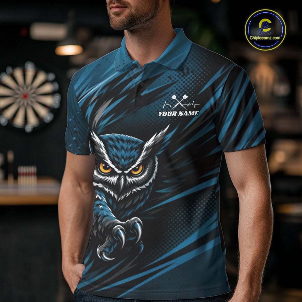 Front view of a man wearing a blue and black darts polo shirt, pairing a striking owl graphic with personalized names, a flying dart, and dartboard.