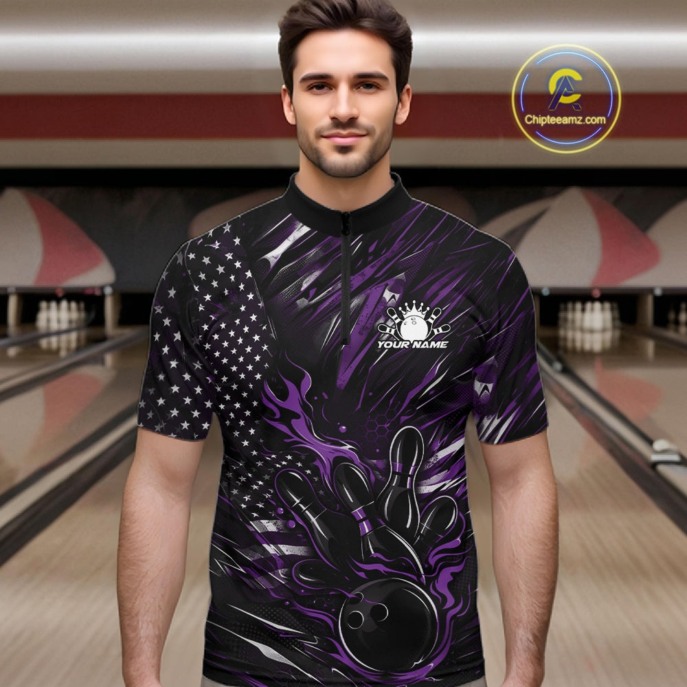 Male model at a bowling lane wearing a black and purple bowling quarter-zip shirt with fiery bowling-themed artwork and patriotic accents.
