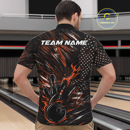 Front view of a male model in a bowling venue wearing a black and orange quarter-zip shirt featuring a flaming bowling ball knocking down pins.
