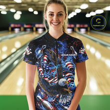 Load image into Gallery viewer, Female model front view in a bowling lane wearing a bowling quarter zip shirt with flaming eagle artwork, blue bowling ball, American flag, and blue flames.