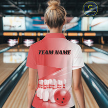 Load image into Gallery viewer, Female model back view at the bowling lane wearing a bowling polo shirt with bowling ball and pins in a pink gradient pattern.