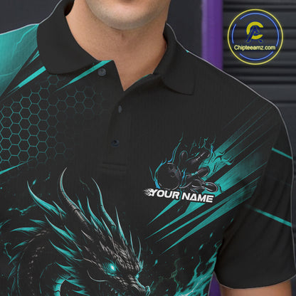A close-up of a man wearing a black short-sleeve polo shirt with a teal and black dragon graphic, a hexagonal pattern on the shoulder, and a customizable chest print that reads 'YOUR NAME'.