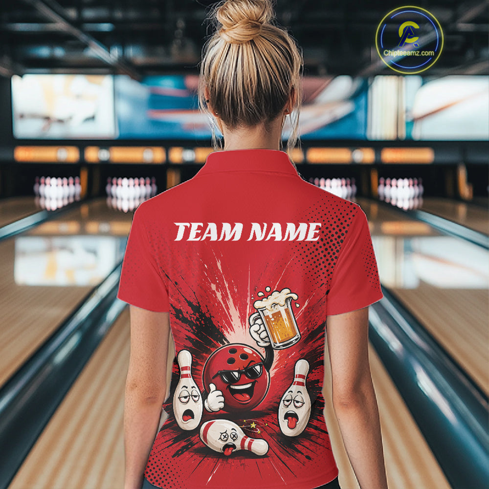 A woman viewed from behind wearing a red bowling-themed short-sleeve quarter zip shirt with a cartoon bowling ball and pins graphic and the text 'TEAM NAME' on the back, standing in a bowling alley.
