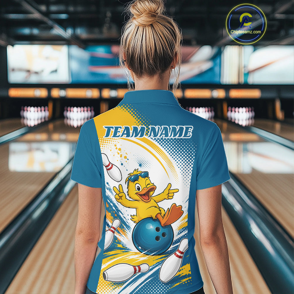 A woman viewed from behind wearing a blue bowling-themed short-sleeve polo shirt with a large graphic of a yellow duck bowling and the text 'TEAM NAME' on the back. 