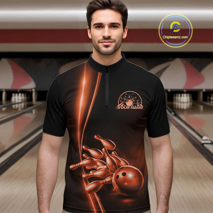 Front view of a male model in a bowling lane wearing a black quarter-zip shirt with orange bowling ball and pins artwork and dynamic bowling action visuals.