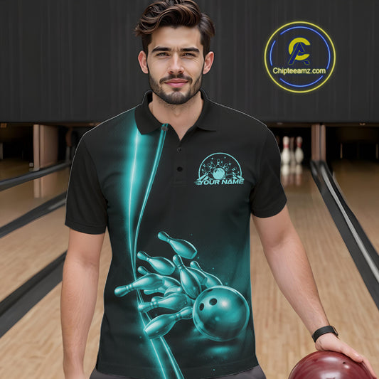 In bowling lane front view male model wearing bowling polo shirt, black base with turquoise blue bowling ball and pins graphic, energetic sports lighting