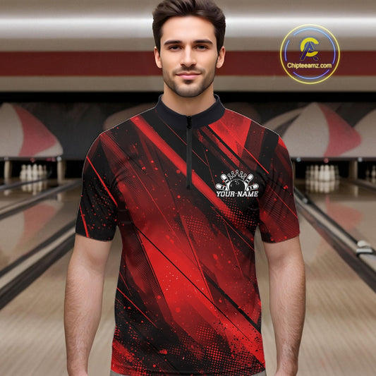 Man wearing a red and black bowling shirt with a personalized logo in a bowling alley.