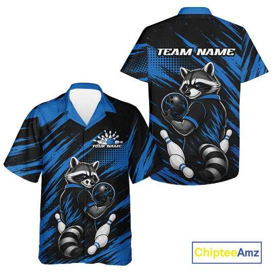 Front and back views of a short-sleeve bowling-themed button up shirt. The shirt features a raccoon bowling graphic on a blue and black brush-stroke background 