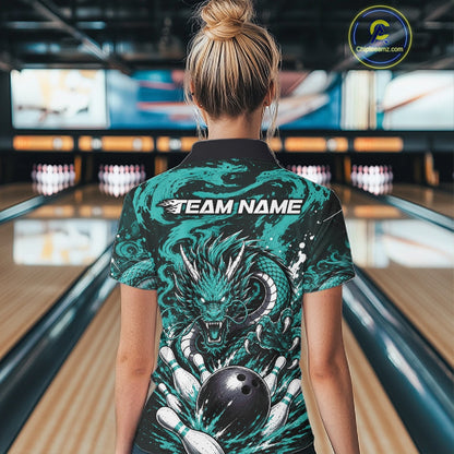 Person wearing a bowling shirt with a dragon design in a bowling alley