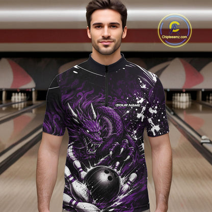 Man wearing a black and purple bowling shirt with a dragon design in a bowling alley.