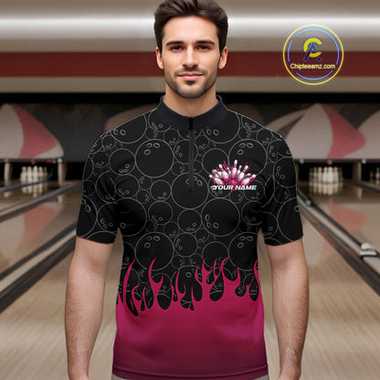 Male model in a bowling alley wearing a black quarter zip shirt, front view featuring bowling ball pattern with vibrant pink flames rising from the bottom and flaming bowling-themed graphics