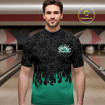 Male model in a bowling lane wearing black quarter zip shirt, front view showcasing bowling ball pattern with turquoise green flames and dynamic bowling artwork