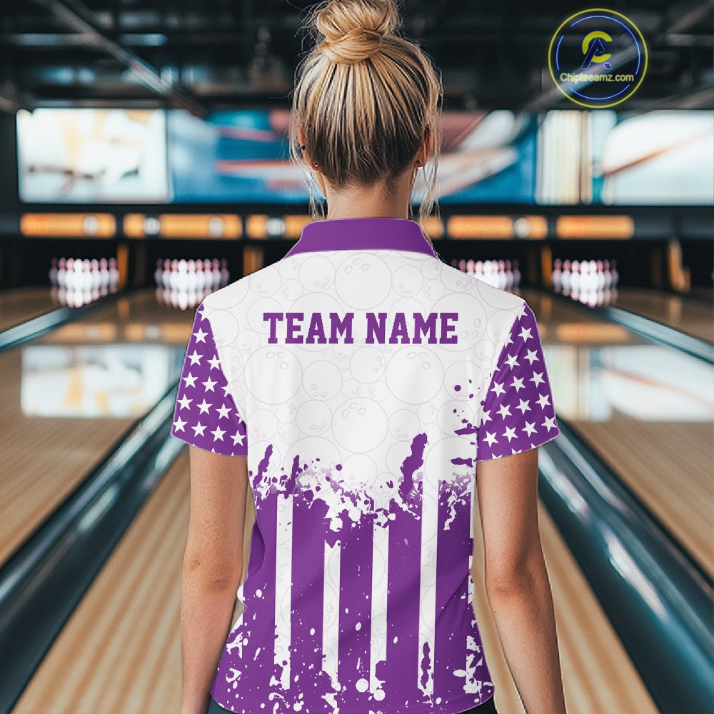 Female model showcasing the back design of a custom purple and white patriotic stars and stripes women's bowling polo shirt with a customizable "TEAM NAME" text template inside a bowling alley.