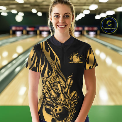 Female model front view in bowling lane wearing black quarter zip shirt with golden metal tribal flame bowling ball hitting pins illustration