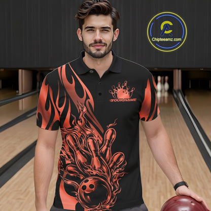 Male model seen from the front in a bowling lane wearing a black polo shirt featuring a red gradient tribal flame bowling ball striking pins in a dynamic action scene.