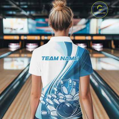 Back view of a women s white and blue bowling quarter zip showcasing flowing curve accents and a bowling ball crashing into pins graphic.