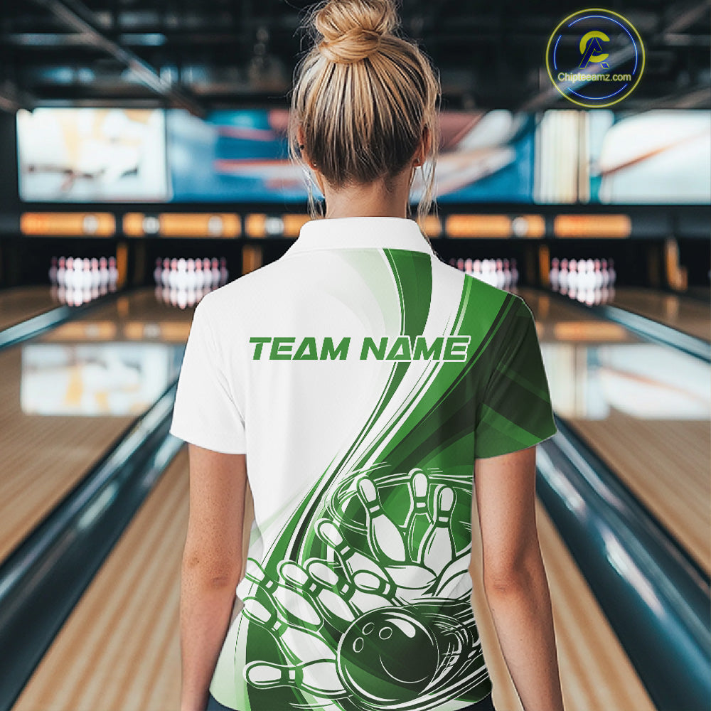 Back view of a women s white and green bowling quarter zip displaying sweeping curve artwork and a bowling ball crashing into pins graphic in a bowling center.