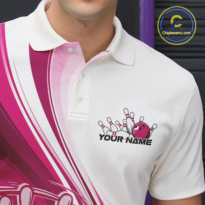 Close-up of the left chest area of a white and pink bowling polo shirt, featuring a dynamic curved bowling ball striking pins design.