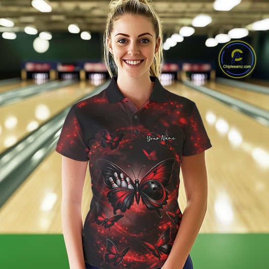 Female model wearing a bowling polo shirt in a bowling center with a red and black butterfly artwork incorporating a bowling ball body.