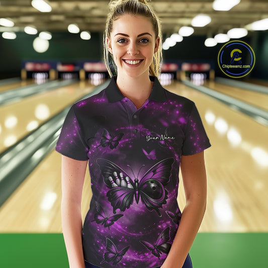 Female model in a bowling venue wearing a bowling polo shirt featuring a purple and black butterfly artwork with a bowling ball body.