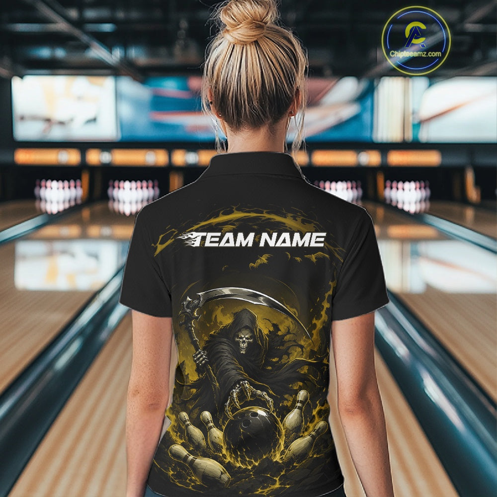 Back view of a female model wearing a black and yellow bowling quarter zip shirt showcasing a grim reaper with a blazing bowling ball striking scattered pins amid swirling flames in a bowling lane.