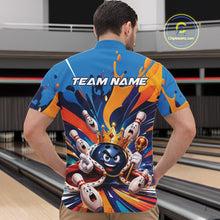 Load image into Gallery viewer, Front view of a male model wearing a bowling quarter zip shirt featuring a crowned cartoon bowling ball holding a royal scepter with cheering animated bowling pins and colorful paint splashes in a bowling lane.
