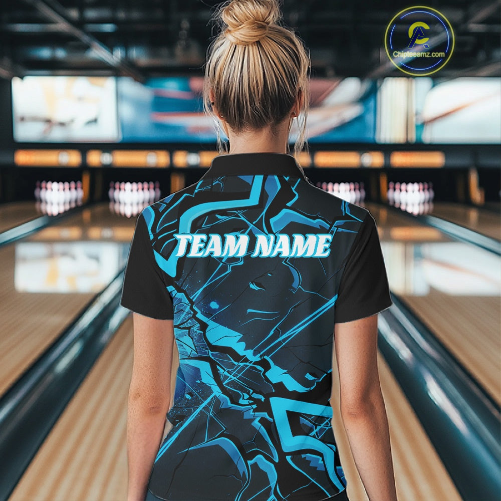 Back view of a womens black and blue bowling quarter-zip showcasing cracked pattern details and angular styling.