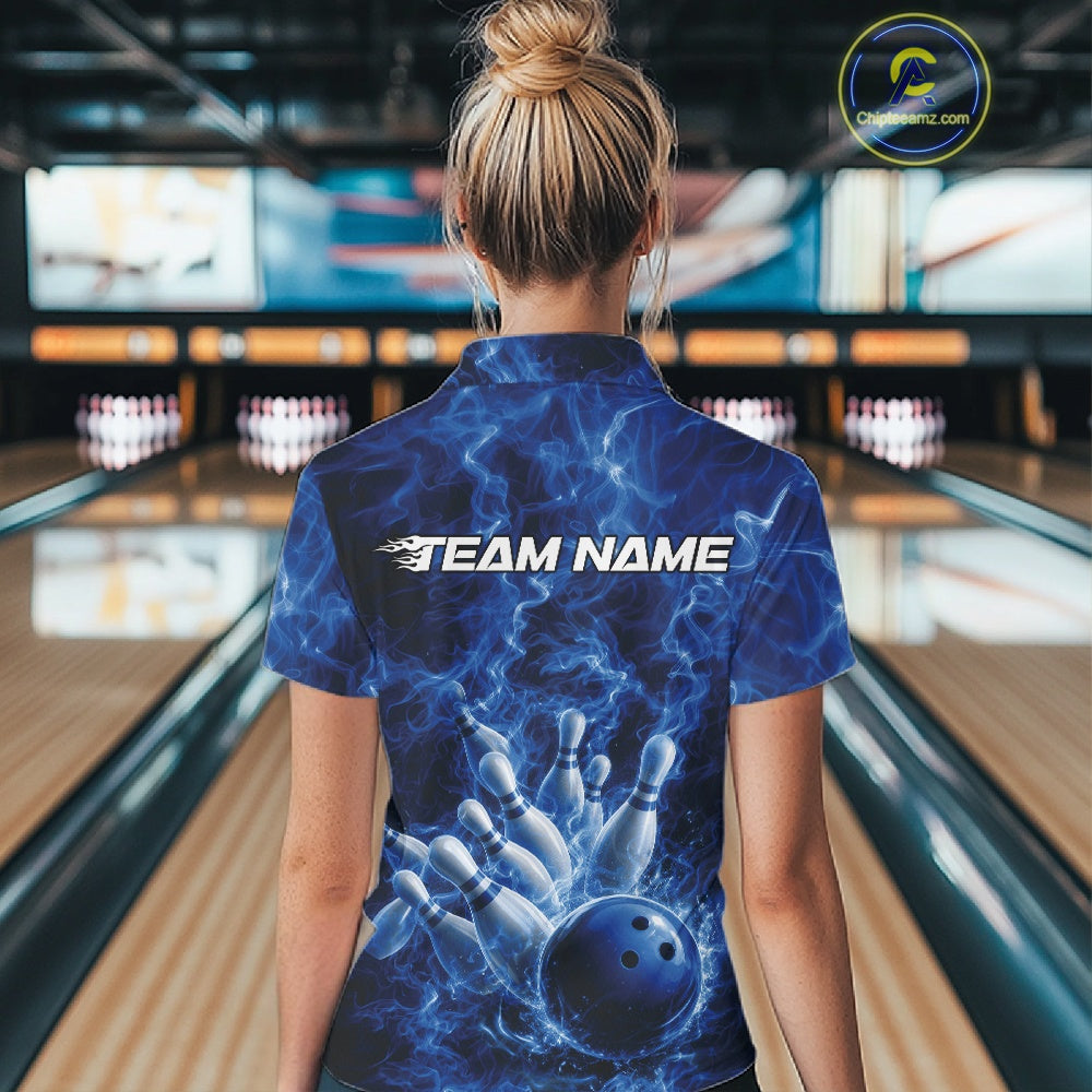 Back view of a womens bowling quarter-zip featuring a blue bowling ball striking pins with dramatic flame artwork.
