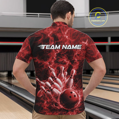Front view of a mens quarter-zip displaying a red bowling ball knocking down pins against a fiery background.