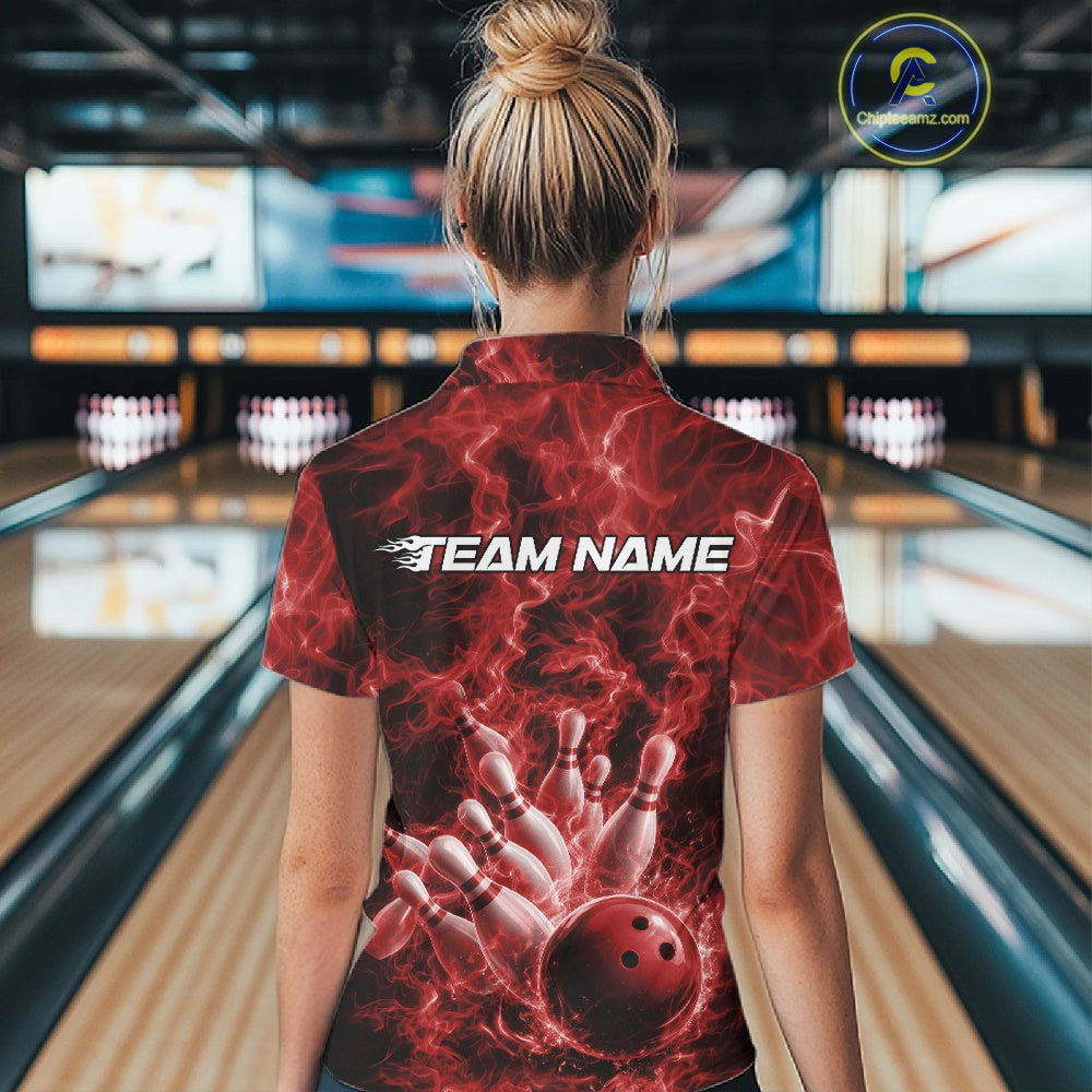 Back view of a womens bowling quarter-zip displaying a red bowling ball hitting pins against a flame background.