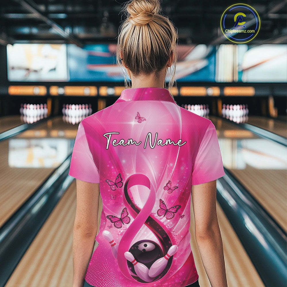 Back view of a womens bowling polo displaying a pink awareness ribbon, bowling pins, and butterfly graphics.